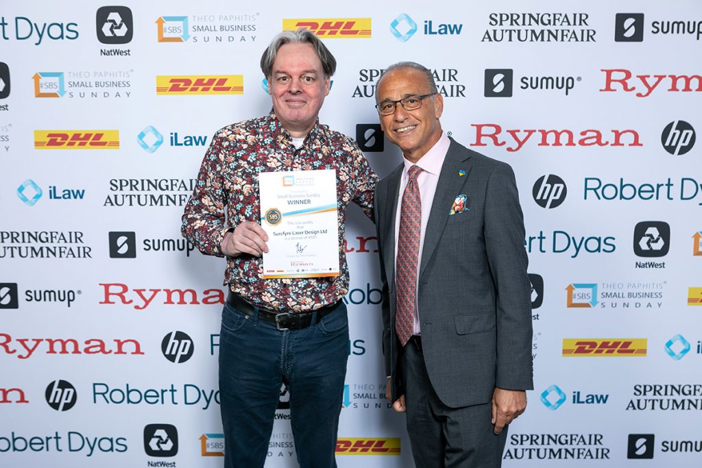 receiving the SBS award from Theo